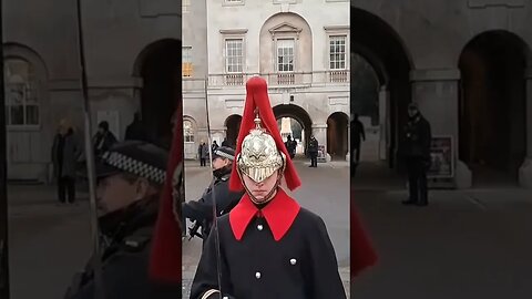 The kings guard moves around the police guard