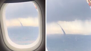Plane passenger witness terrifying tornado forming in the sky