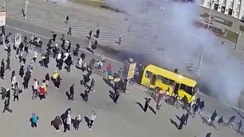 Pro-Ukrainian demonstrators scatter as Russian troops open fire