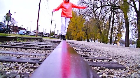 Girl Shows off Amazing Balance on Train Tracks!