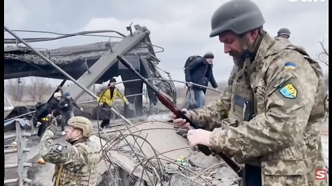 Ukrainian soldiers fire at drone as civilians attempt to evacuate Irpin during shelling