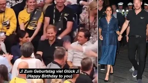 Harry! Prince waves awkwardly as stadium full of fans belts out German version of Happy Birthday as