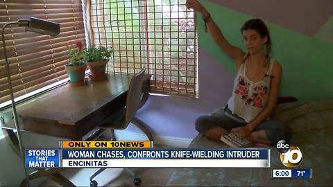 Woman confronts knife-wielding intruder