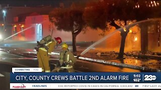 City, county crews battle two alarm fire