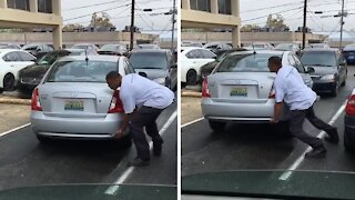 Guy picks up a car and move it with ease