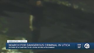 Utica police searching for man caught on camera torching garage after robbery