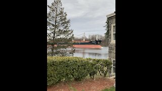 Huge ship going down the river
