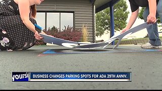 Local business changing handicapped parking for ADA anniversary