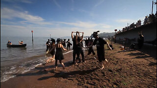 Beltane Border Morris - Jolly Roger - on the beach at Teignmouth Folk Festival 2014