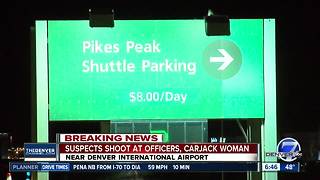 Suspects carjack person from DIA parking lot after opening fire on police