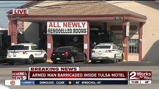 Armed man barricaded inside Tulsa motel