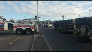 Cyclist rescued from under truck (pgY)