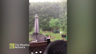 Heavy rain, with small hail, soaks Quebec yard