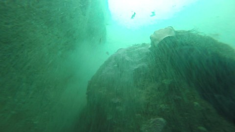 Fearless diver swims underneath cave in one breath