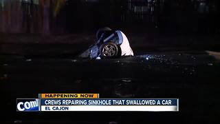 Crews work to repair sinkhole that swallowed car