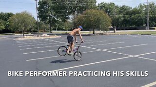 Bike Performer Practicing His Skills.￼