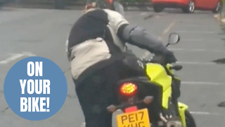 Hilarious footage shows biker struggling to mount bike