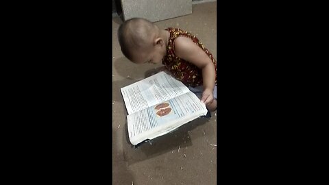 Ma sha Allah.....Samall baby read a book with full attention.