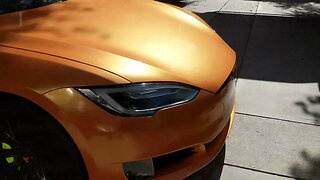 SEMA Orange Tesla