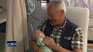 Volunteer baby cuddlers bring comfort to NICU preemies and their families