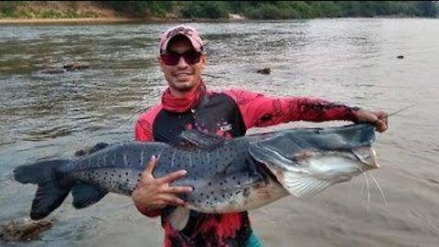 boy fishing awesome giant fish