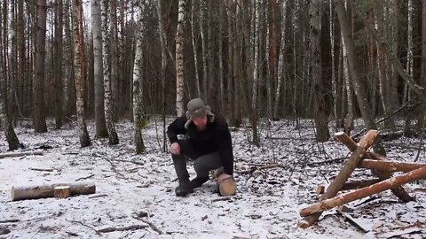 hiding in a huge dugout during a snow storm, spending the night in bushcraft shelter * 2