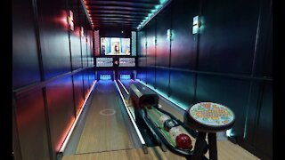Local entrepreneur builds first-ever mobile bowling alley inside semi