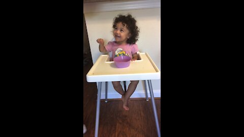 Well behaved toddler is asked not to eat while her mom leaves the room