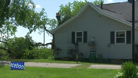 Suring clean-up after damage from the storm and bracing for potential severe weather