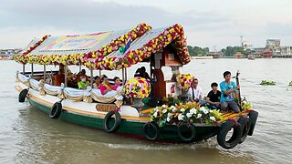 Tradition of giving alms by boat at Koh Kret Island In Thailand