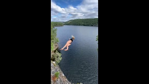 I am with my friend and she is teaching me how to swim in the beautiful lake