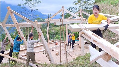 Asian Girl Installing A New Wodden House Frame, Building a new house frame with Peaceful life