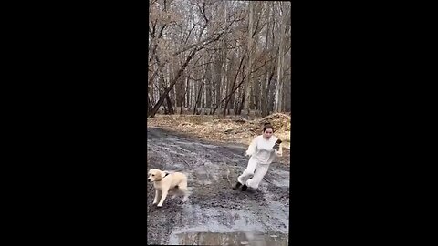 chick running with her dog slips and is dragged through mud puddle