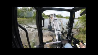 clearing trees from the old farm pond dam with Bobcat e42 R series mini excavator