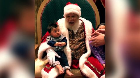 Baby Refuses To Leave Santa Claus