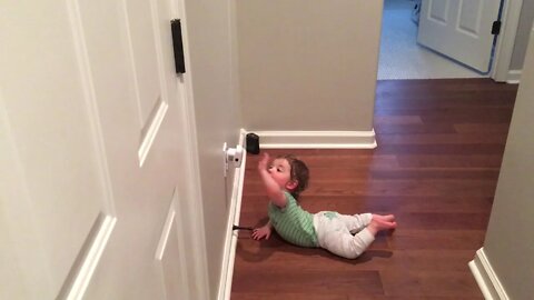 Grant playing with doorstop