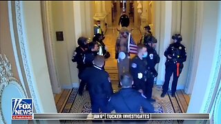 January 6 Video Shows Capitol Police Escorting QAnon Shaman To Senate Floor