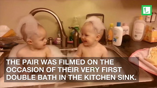 Mom Puts Twins in Sink for Bath. Baby on Right Can’t Stop Laughing When Twin Does This