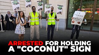 Five CAGE staff arrested for holding up 'coconut' signs