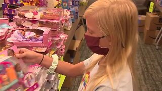 10-year-girl delivers presents to children at the Children Hospital of Michigan