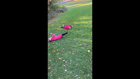 Dassie & Hessy rolling down hill at Eugene Levy Park