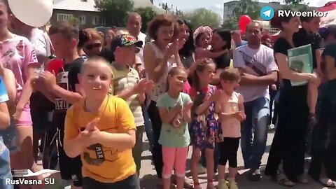 The Russian Army and hundreds of children in the liberated settlement