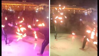 Duo Partners Control Metal Fire Tools In Wedding Ceremony