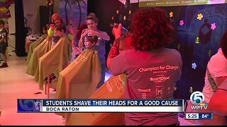 Students shave their heads for a good cause