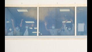 Health workers in Brackenfell wave with arms in the air as they welcome the Gift of the Givers