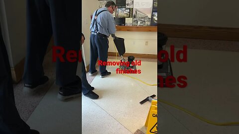 Florida International university techs remove old finishes before polishing terrazzo