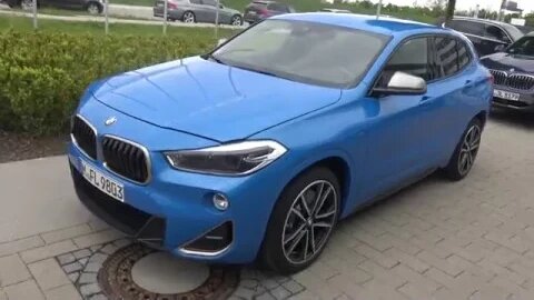 Shorter look BMW X2 M35i Misano Blue with Cerium Gray M Performance specific parts parked [4k]