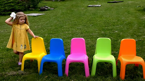 Diana fun playing outdoors and looking for colored chairs