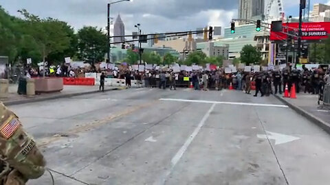 Georgia National Guard medics treat overheated protester