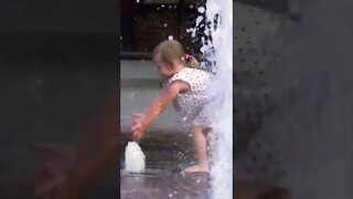 Little Girl Playing With Water